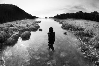 A boy walking in the nature of dolomites