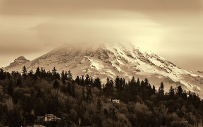 Clouds cover mount rainier across the puget sound in washington state.