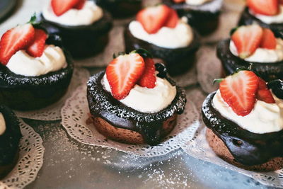 Close-up of cupcakes on cake