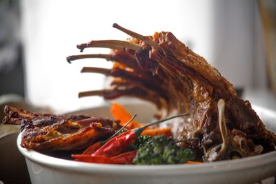 Pork ribs baked with chili, broccoli and carrots