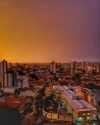 High angle view of buildings against sky during sunset