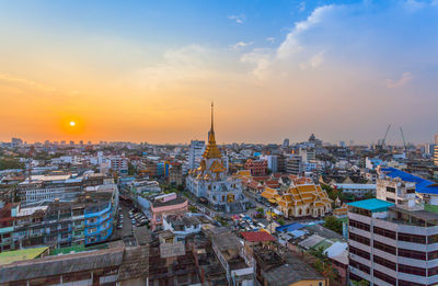 Cityscape against sky during sunset