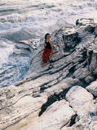 Woman standing on rock