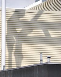 Low angle view of closed shutter of building