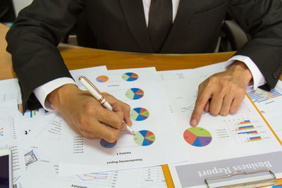 Close-up of man working on table