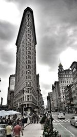 People on street by flatiron building