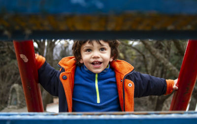 Boy on play equipment