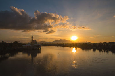 Scenic view of lake against sky during sunset