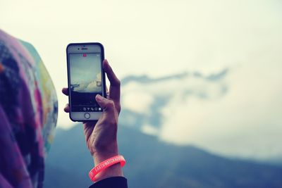 Man photographing with mobile phone