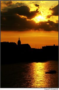 Silhouette of pier at sunset