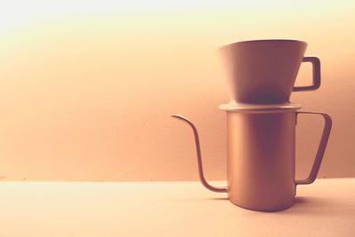 Close-up of coffee cup on table