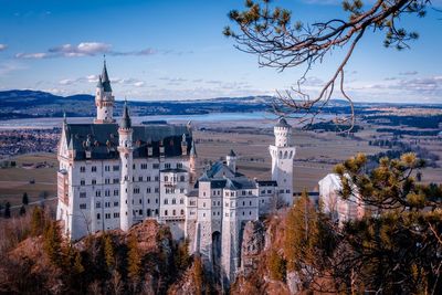 Neuschwanstein castle against cloudy sky