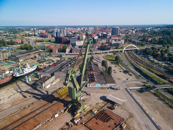 High angle view of city street and buildings against sky