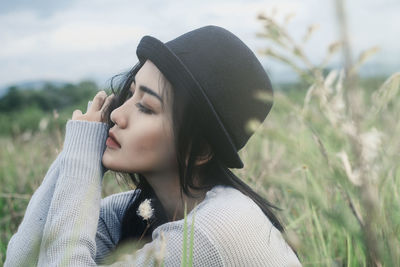 Close-up of young woman in meadow