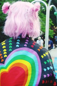 Rear view of person with multi colored umbrella