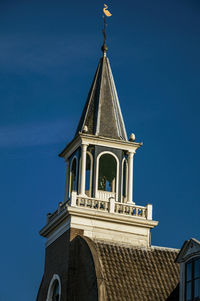 Low angle view of building against blue sky