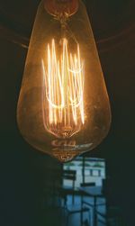 Close-up of illuminated light bulb