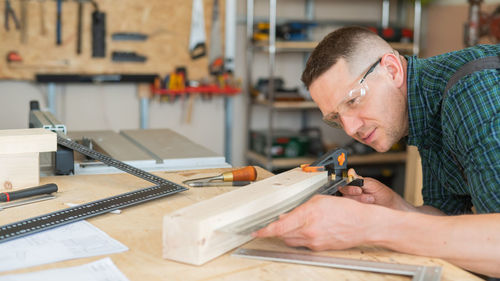 Close-up of man working in workshop