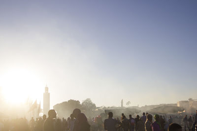 People at town square against sky