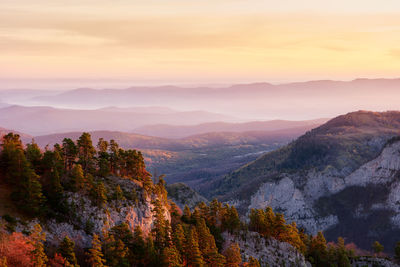 Scenic view of mountains against sky during sunset