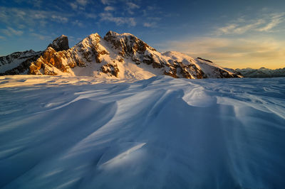 Scenic view of snowcapped mountains against sky