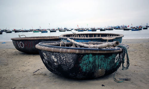 Fishing boats on shore at beach