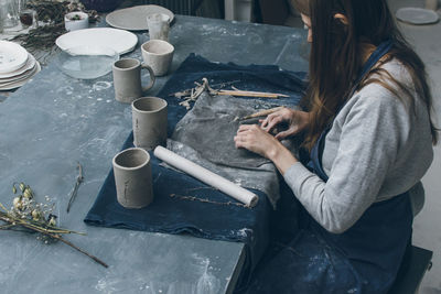 High angle view of woman working at table