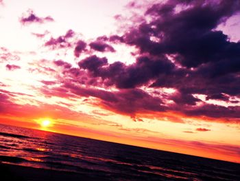 Scenic view of sea against cloudy sky