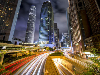 Light trails on road in city at night