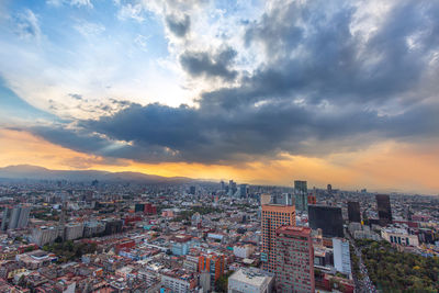 High angle view of city buildings during sunset