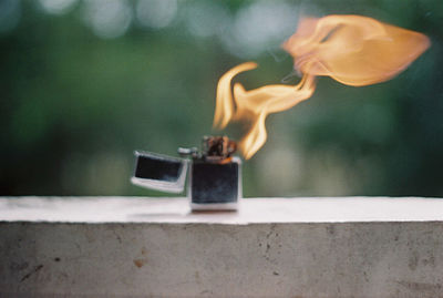 Close-up of cross on retaining wall