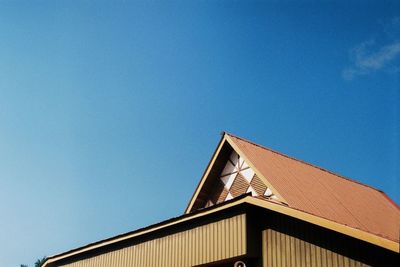 Low angle view of building against clear blue sky