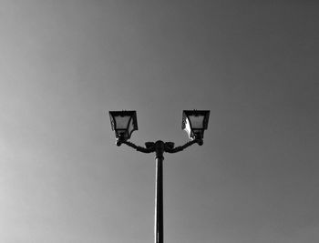 Low angle view of street light against sky