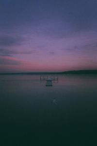 Scenic view of sea against sky at sunset