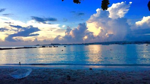 Scenic view of sea against sky at sunset