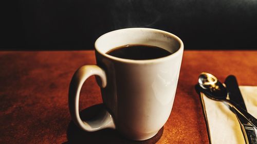 Close-up of coffee cup on table