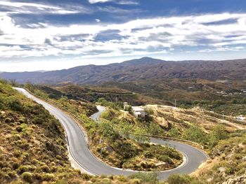 High angle view of road amidst mountains against sky