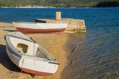 Boat moored on shore