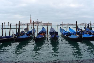 Boats moored in canal