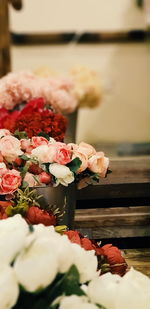 Close-up of red rose on table