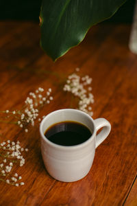 High angle view of coffee cup on table