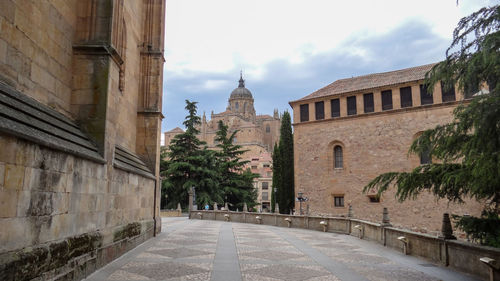 Street amidst buildings against sky