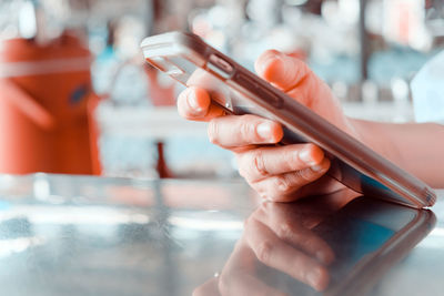 Close-up of person holding mobile phone