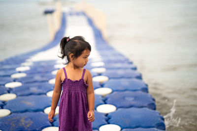 Girl looking at camera on beach