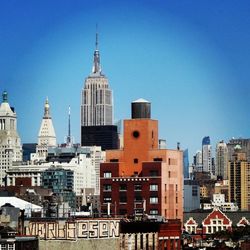 Urban skyline against clear sky