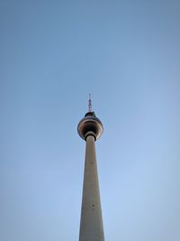 Low angle view of communications tower against clear sky