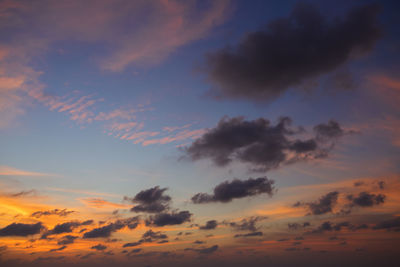 Low angle view of dramatic sky during sunset