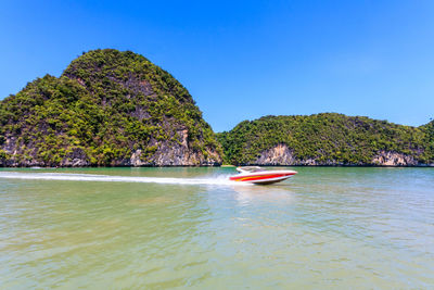 Scenic view of sea against clear blue sky