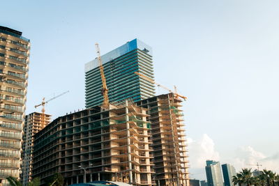 Low angle view of modern buildings against clear sky