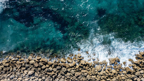 High angle view of pebbles on beach